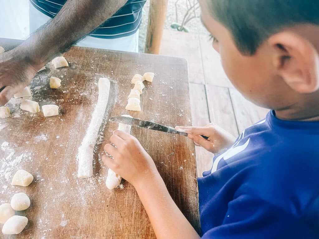 my son cutting gnocchi