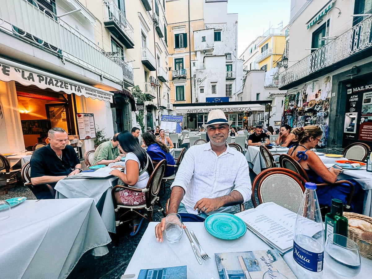 my husband at a cafe in Amalfi