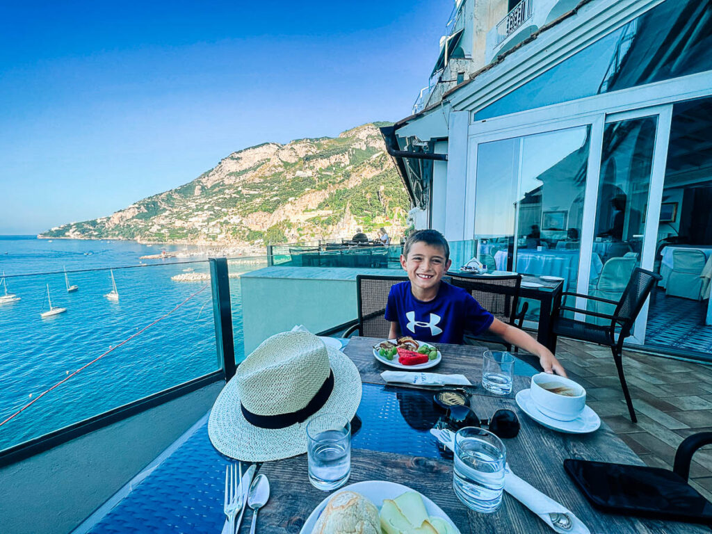 my son eating breakfast at Hotel Luna Convento in Amalfi