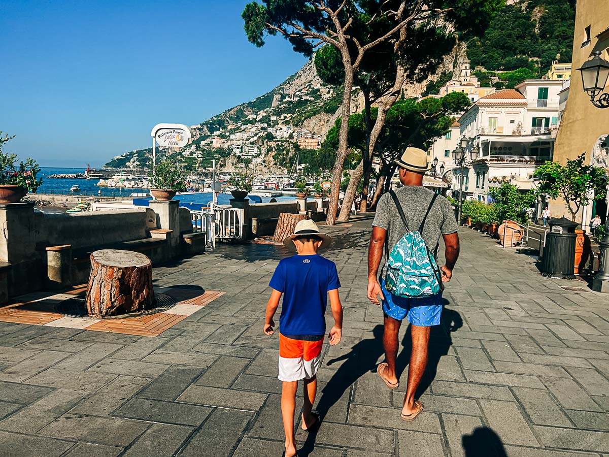 my husband and son walking in Amalfi town