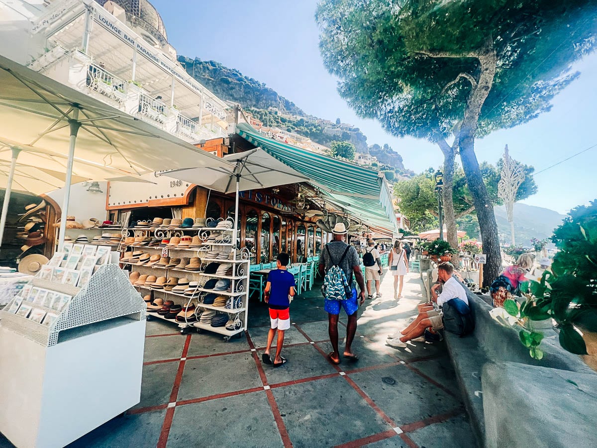 my husband and son walking down the street in Positano