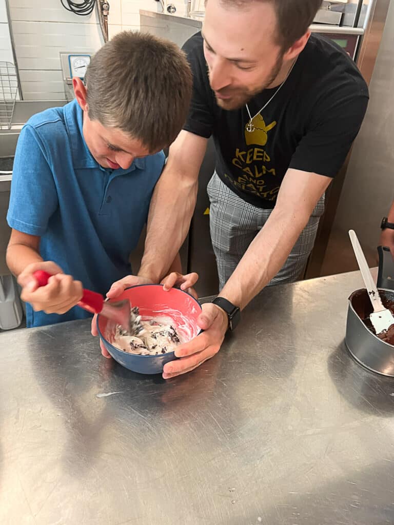 my son learning to mix ice cream at Pistachio Verde in Rome