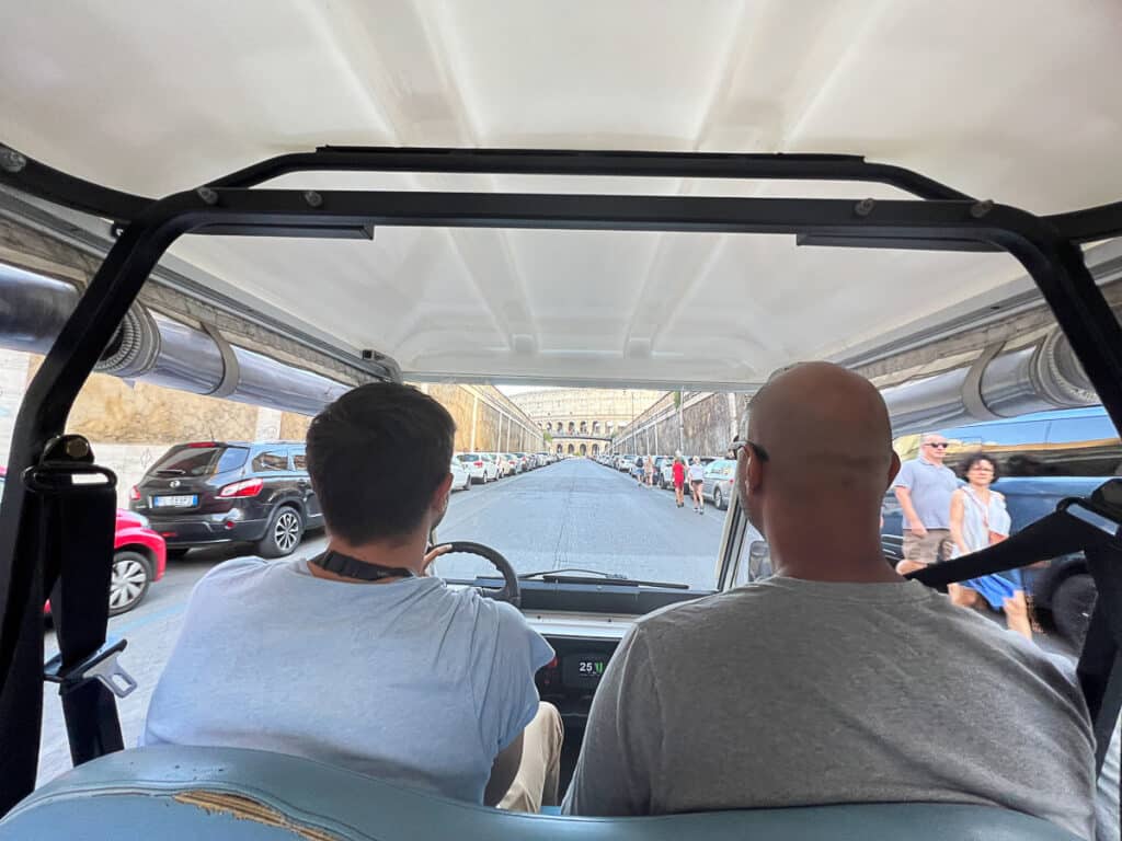 my husband and our tour guide on the golf cart tour of Rome