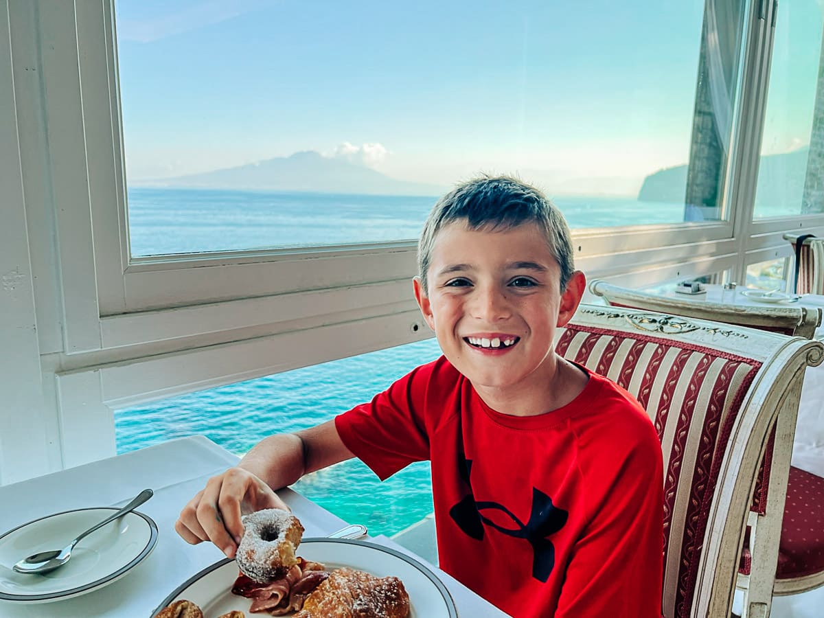 my son eating breakfast at the hotel restaurant