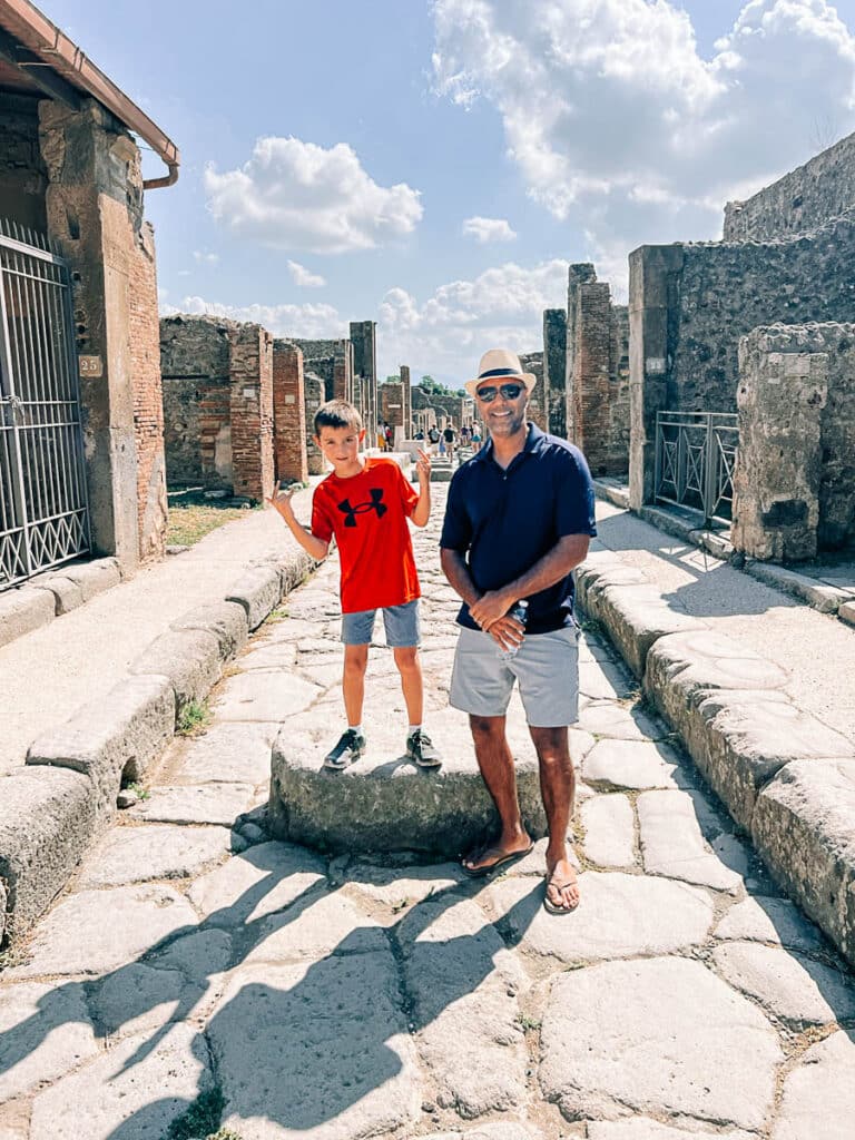 my son and husband on a tour of pompeii