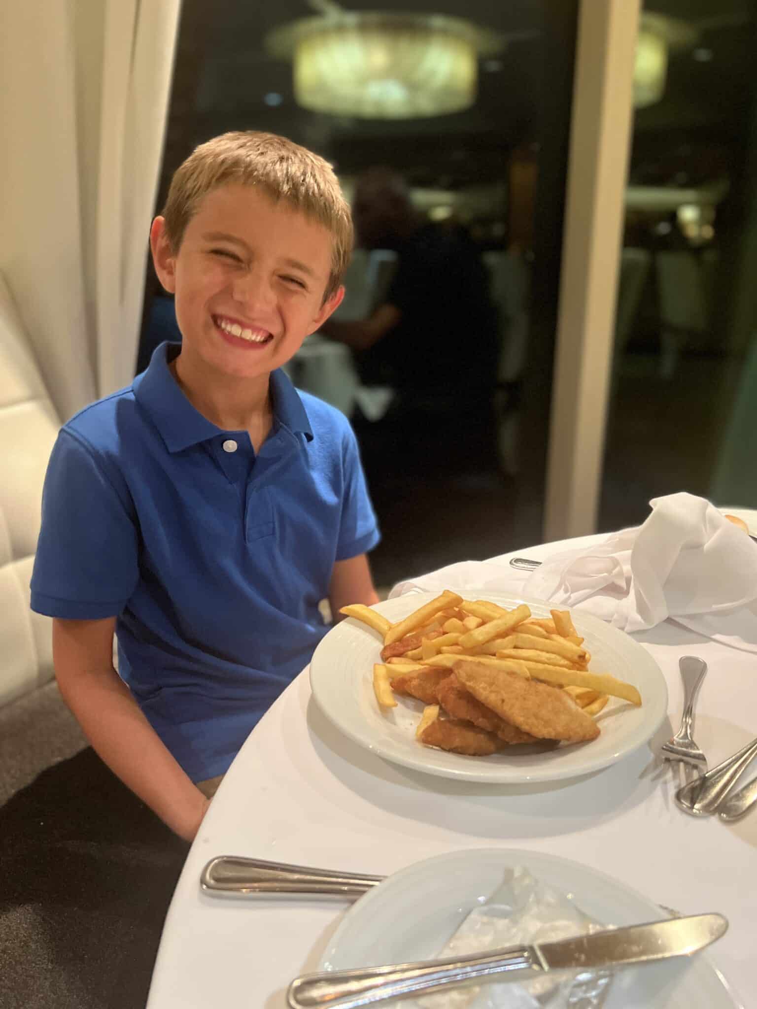 my son in the main dining room on a royal caribbean ship