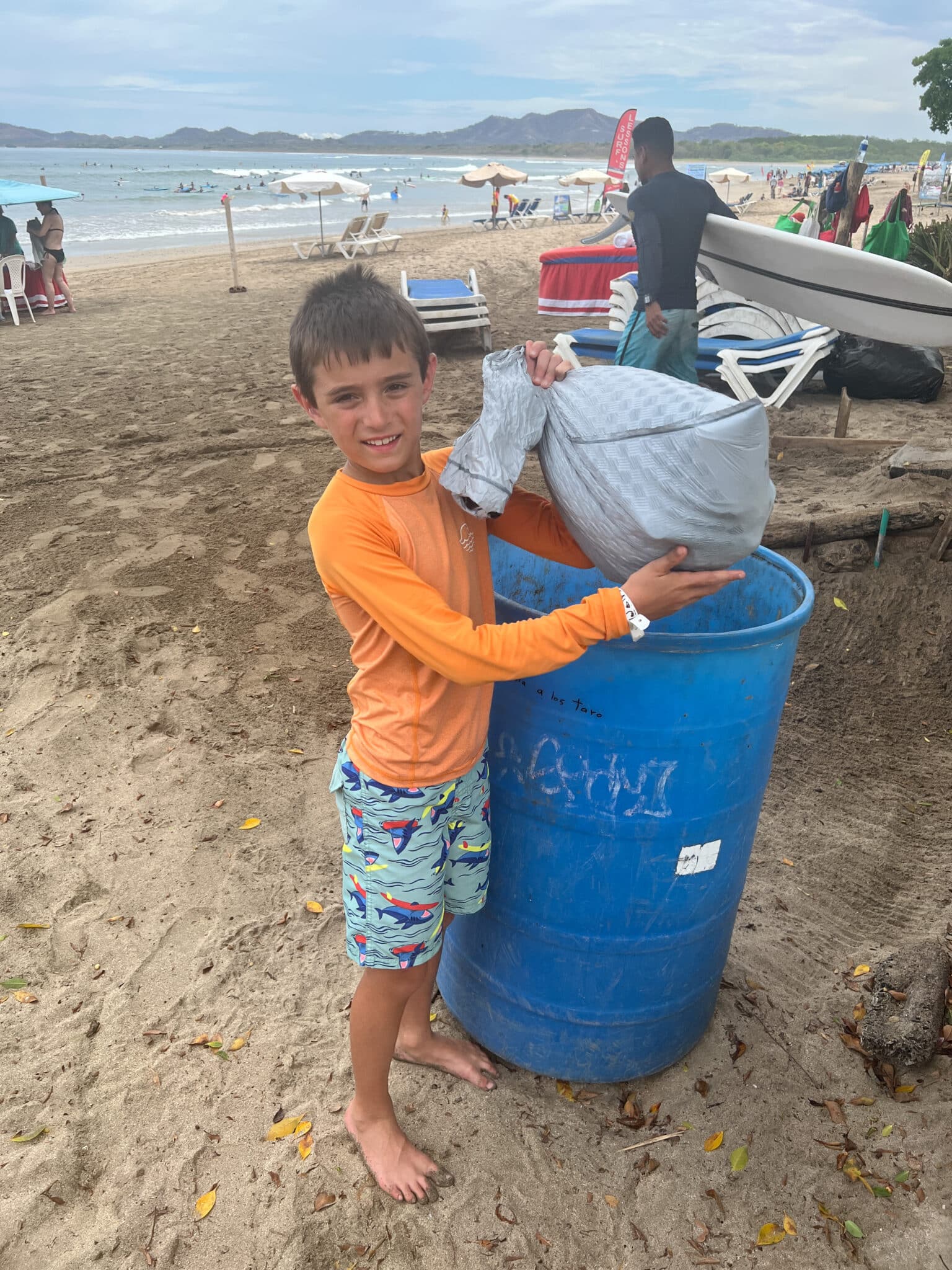 my son at a beach cleanup in Costa Rica