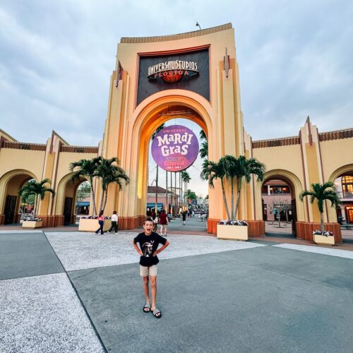 my son at the entrance gates to Universal Studios Orlando