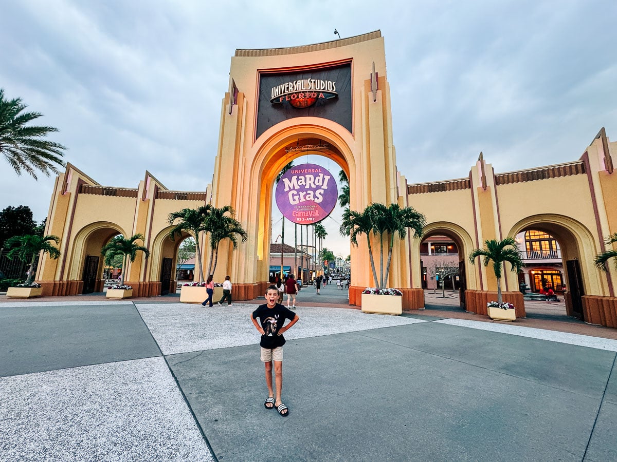 my son at the entrance gates to Universal Studios Orlando
