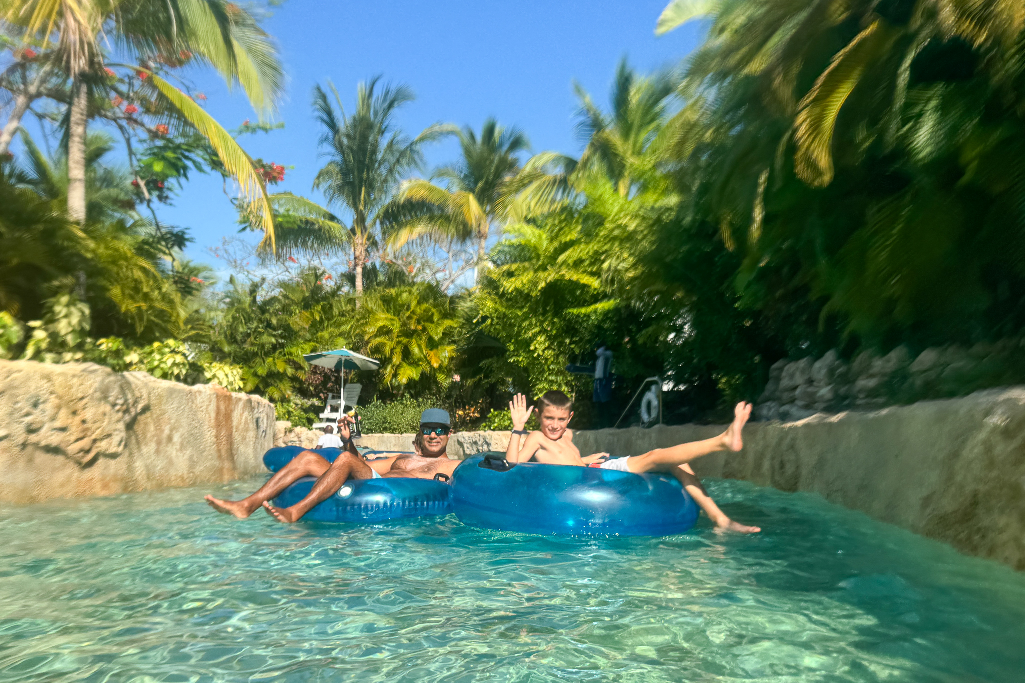 my son and husband on the lazy river at Baha Mar