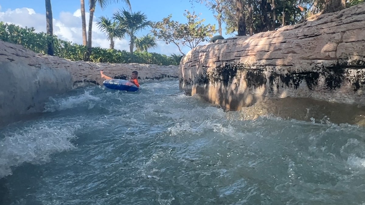 my son on the Rapid River at Atlantis