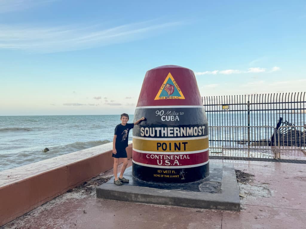 my son at the Southernmost Point Buoy