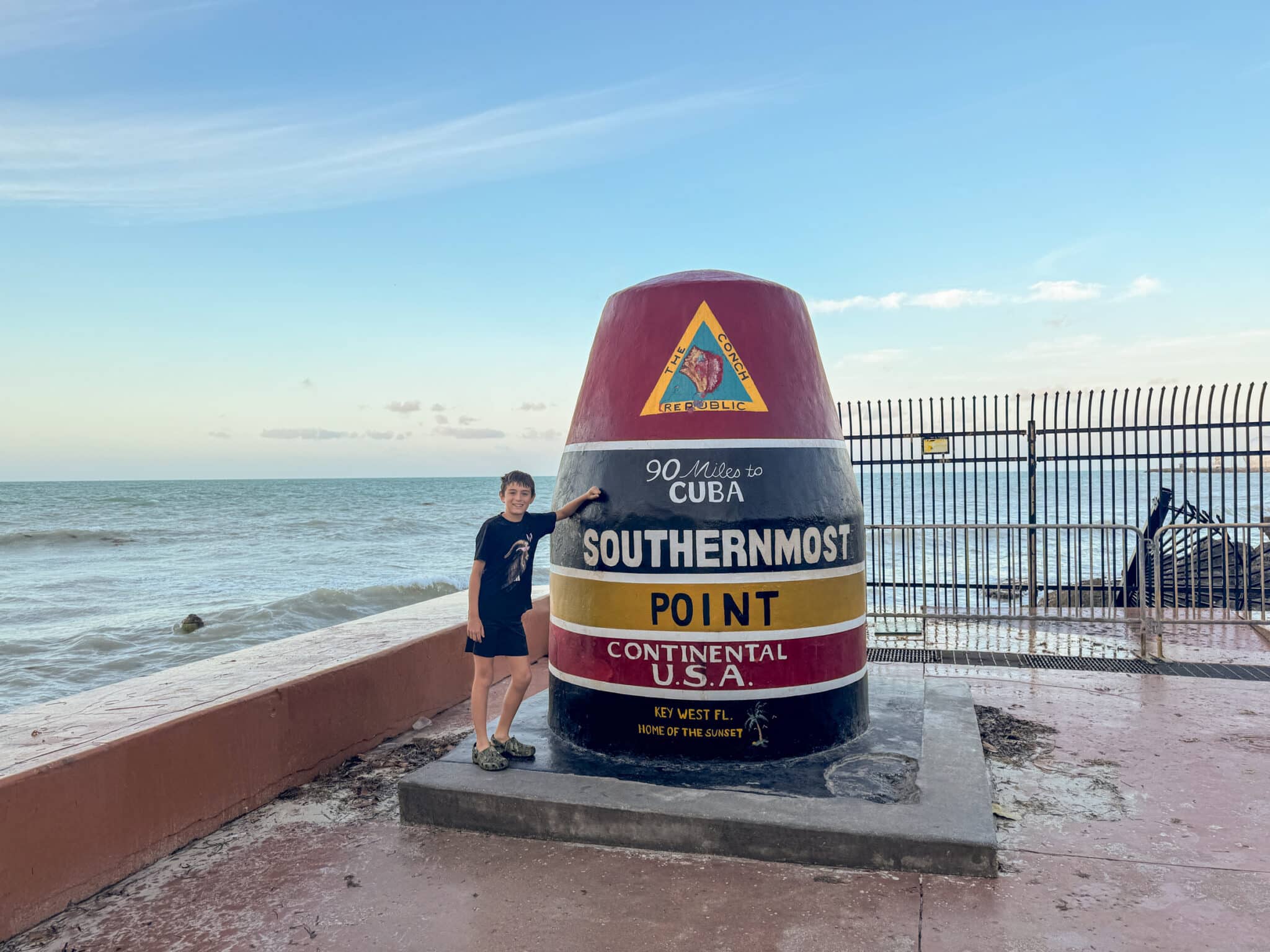 my son at the Southernmost Point Buoy