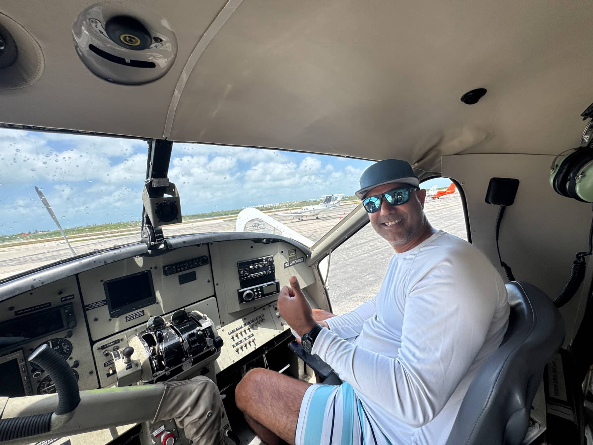 my husband in the cockpit of the seaplane