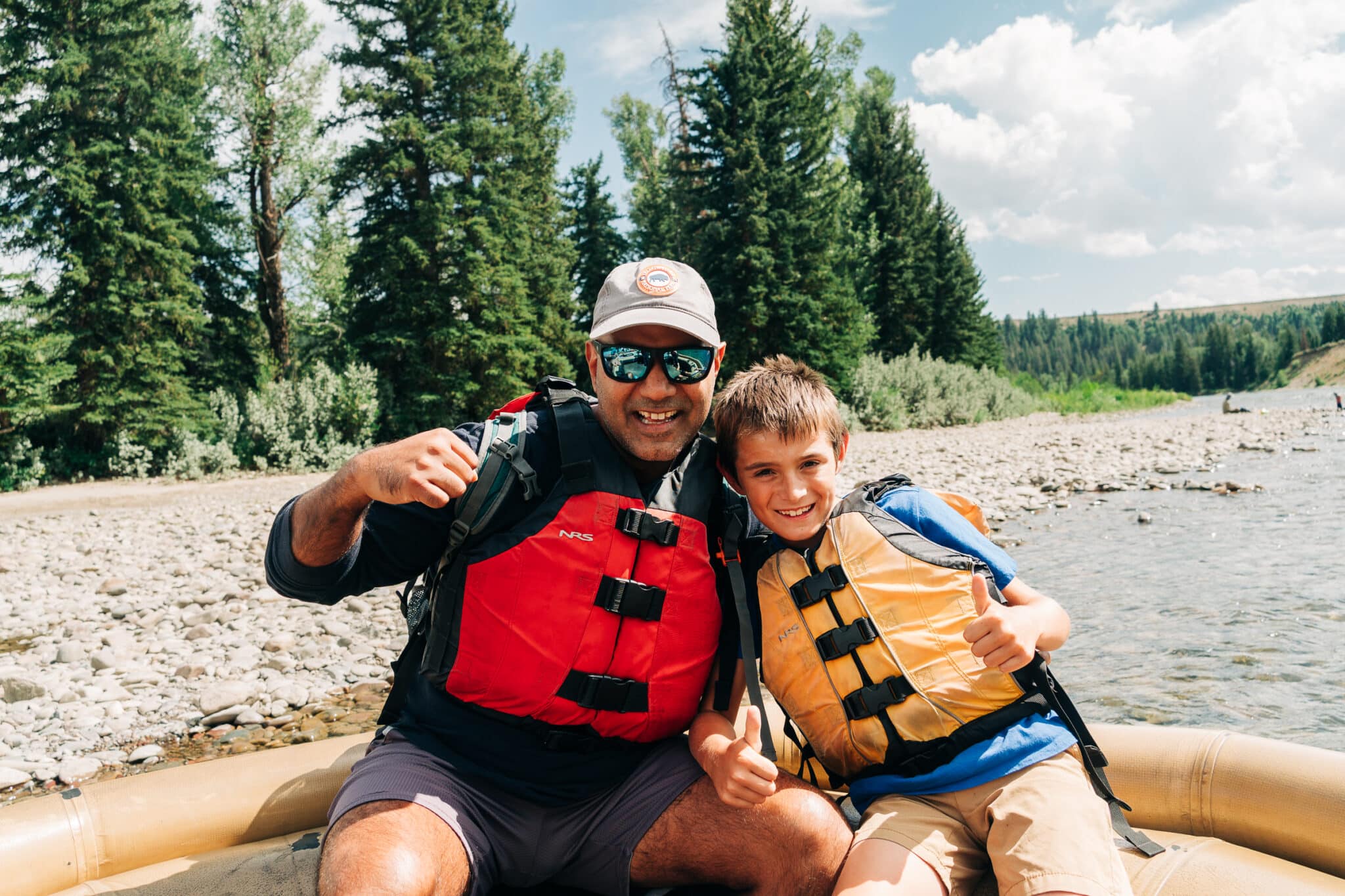 my husband and son on the river float