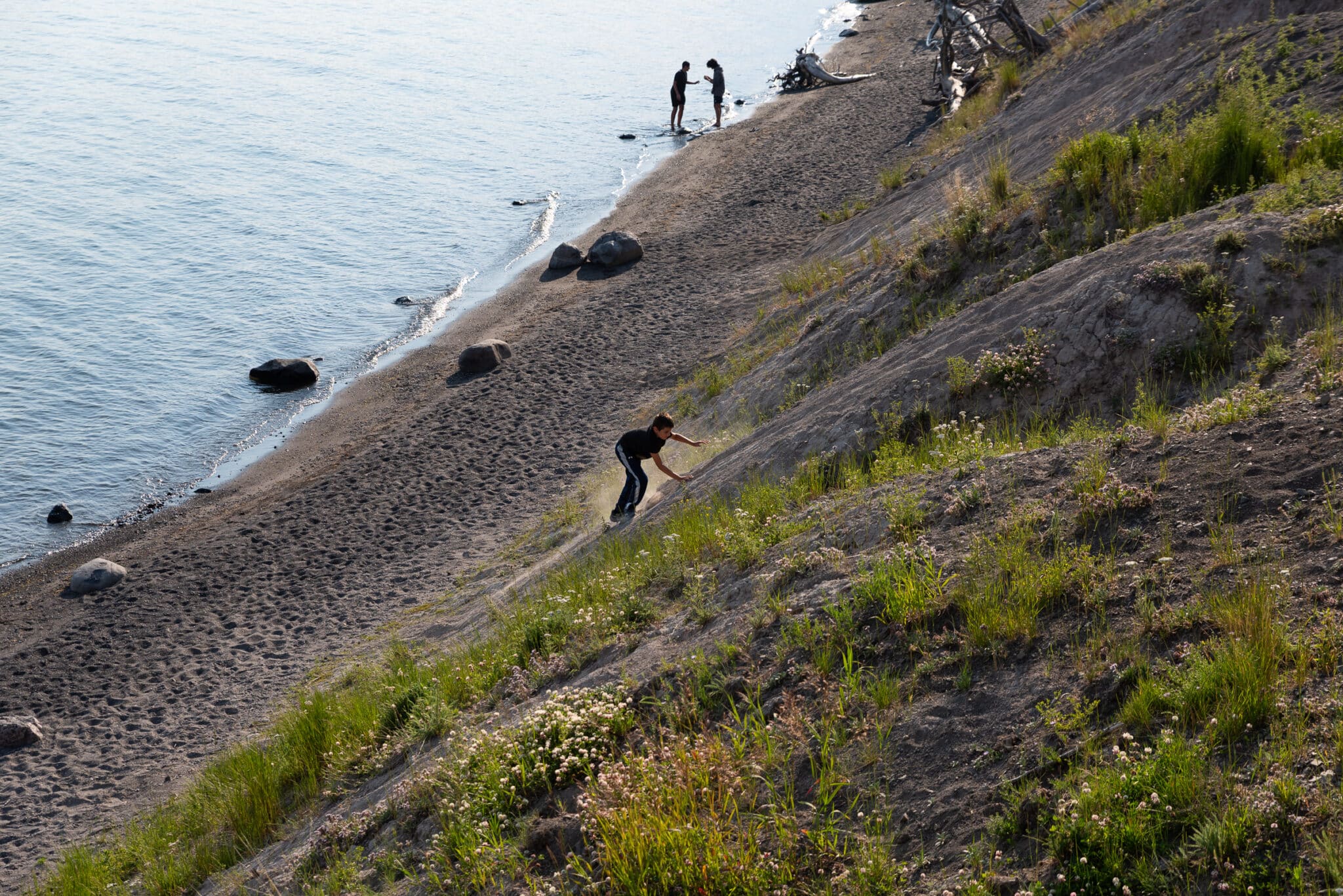 my son climbing down to Lake Yellowstone