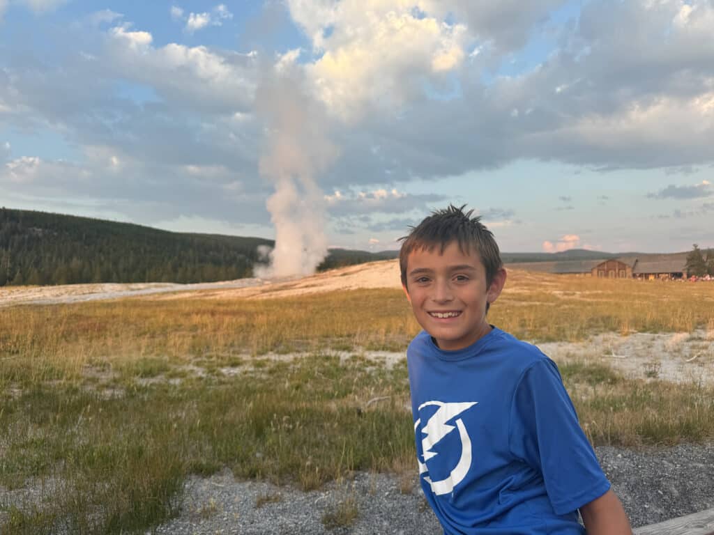 my son watching Old Faithful erupt