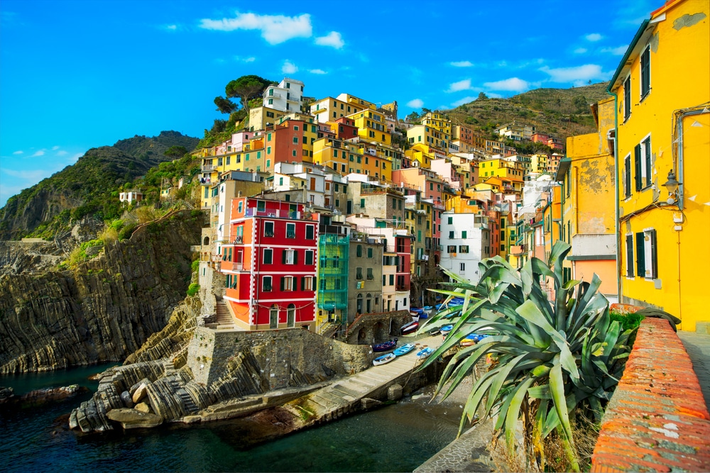 Riomaggiore village, rocks and sea at sunset. Cinque Terre, Ligu