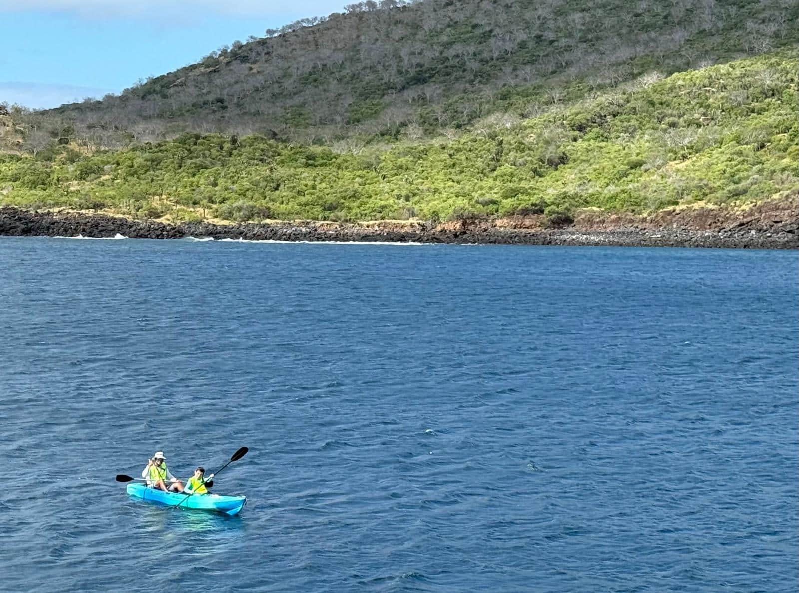 my husband and son kayaking in the galapagos