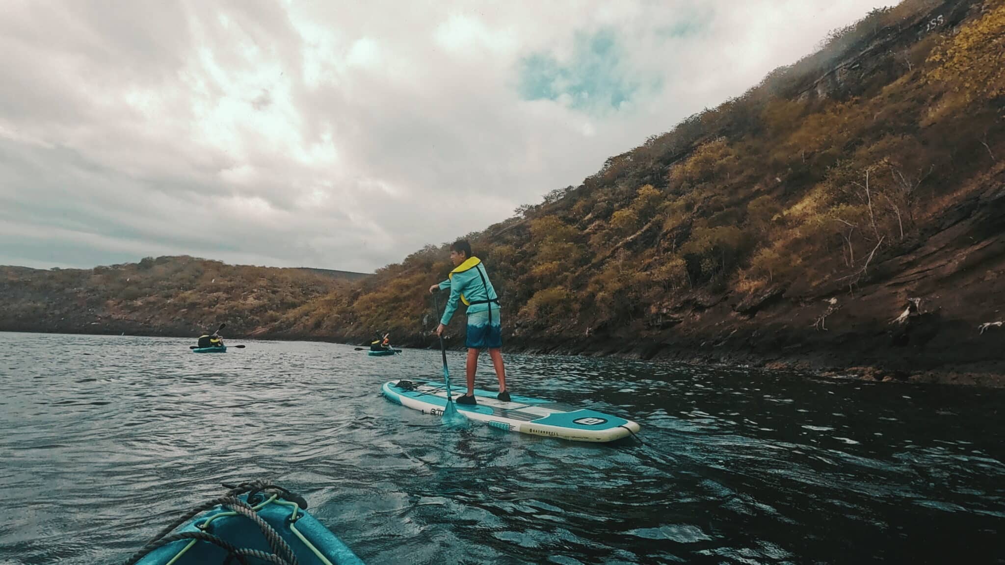 my son paddleboarding at tagus cove in galapagos